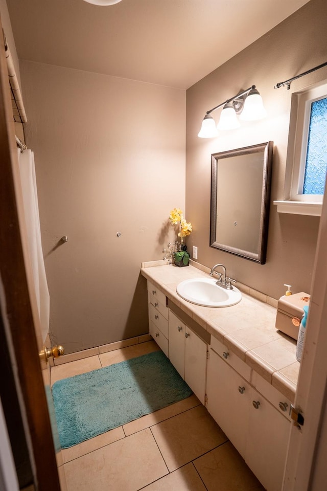 bathroom with tile patterned floors and vanity