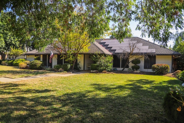 single story home with a front lawn