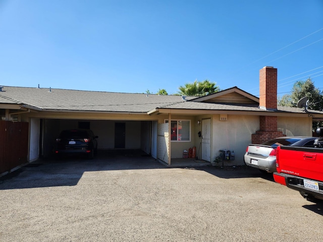 ranch-style house featuring a garage