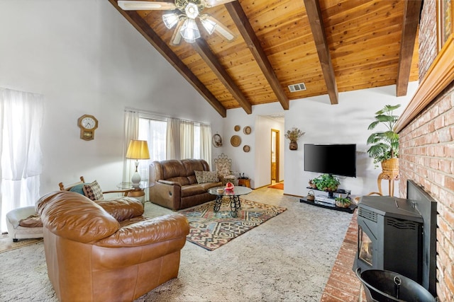 carpeted living room with wood ceiling, a wood stove, beam ceiling, high vaulted ceiling, and ceiling fan