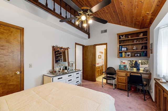 bedroom featuring ceiling fan, wood ceiling, built in desk, light carpet, and vaulted ceiling