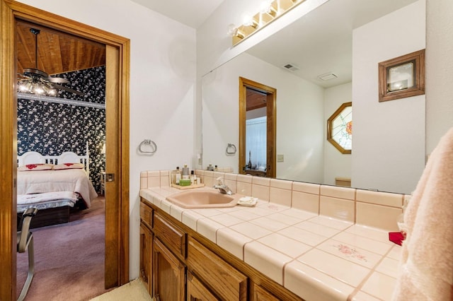 bathroom featuring vanity and ceiling fan