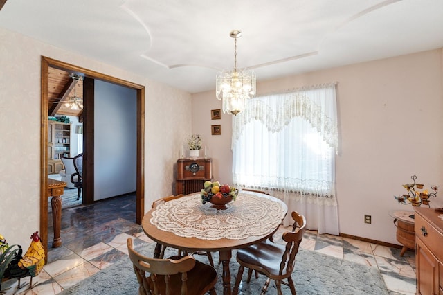 dining area featuring a notable chandelier