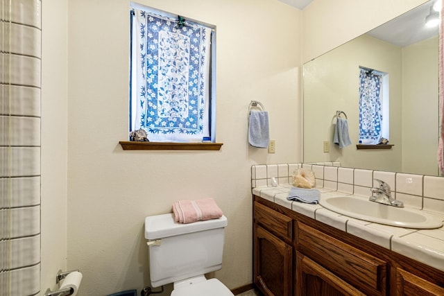 bathroom with vanity and toilet