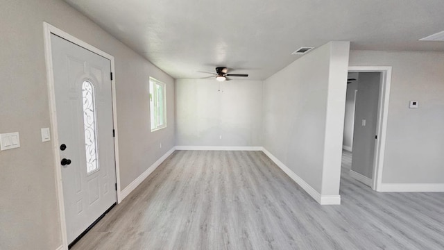 foyer with ceiling fan and light hardwood / wood-style flooring