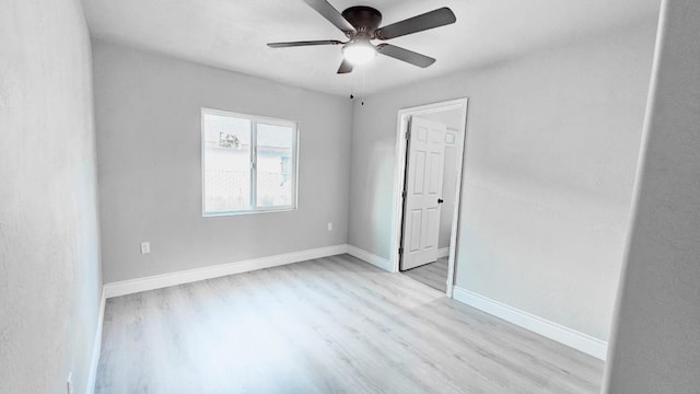 unfurnished room featuring ceiling fan and light hardwood / wood-style flooring