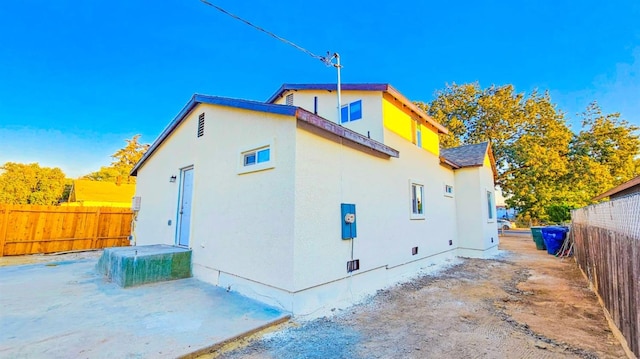 view of property exterior featuring a patio