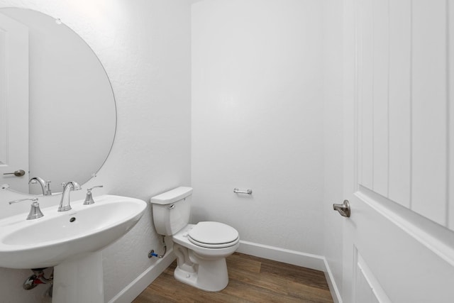 285 S Huckleberry Ln S, S, CA 93636 - bathroom featuring baseboards, wood finished floors, toilet, and a sink