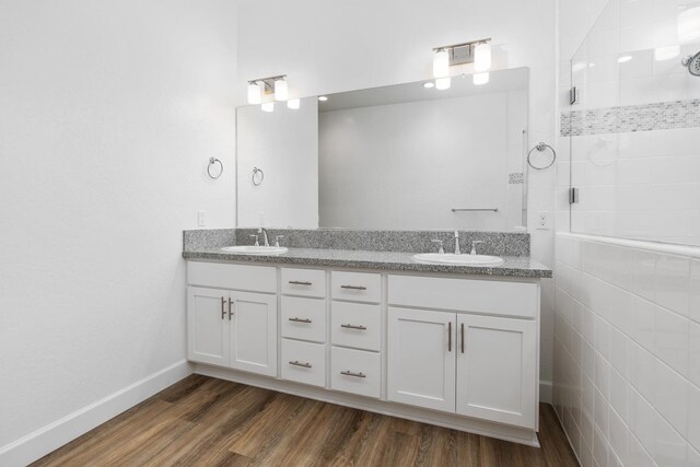 285 S Huckleberry Ln S, S, CA 93636 - full bath with double vanity, a sink, baseboards, and wood finished floors