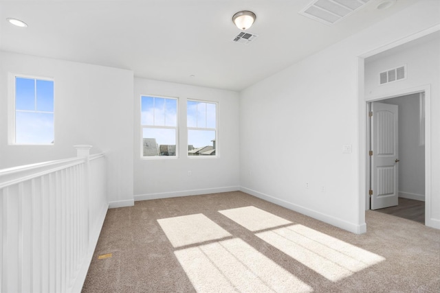 unfurnished room featuring carpet, baseboards, and recessed lighting