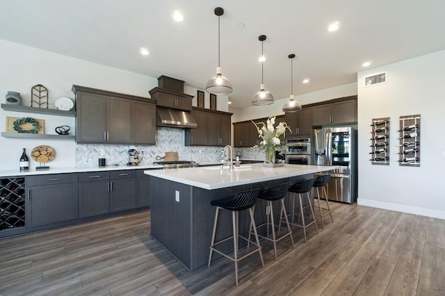 1007 Highland Rd W, Madera, CA 93636 - kitchen featuring appliances with stainless steel finishes, open shelves, light countertops, dark brown cabinets, and tasteful backsplash