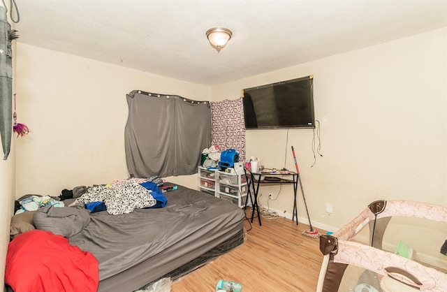 bedroom with hardwood / wood-style flooring