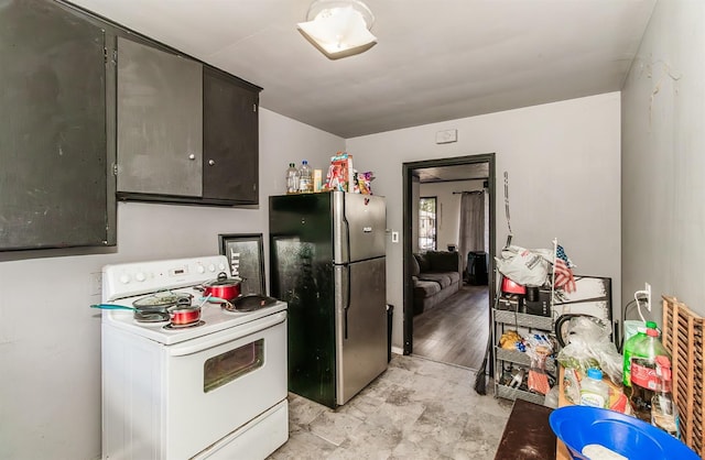 kitchen with stainless steel refrigerator, light hardwood / wood-style floors, and white electric range oven