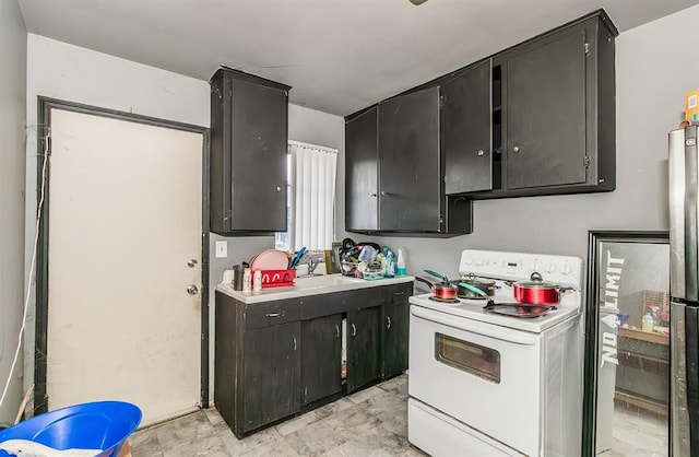 kitchen featuring electric range and sink