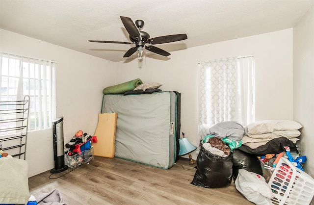 bedroom featuring ceiling fan and light wood-type flooring