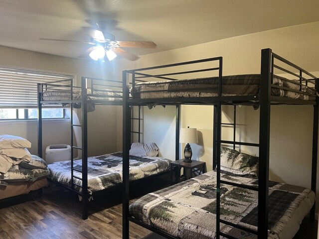 bedroom with wood-type flooring and ceiling fan