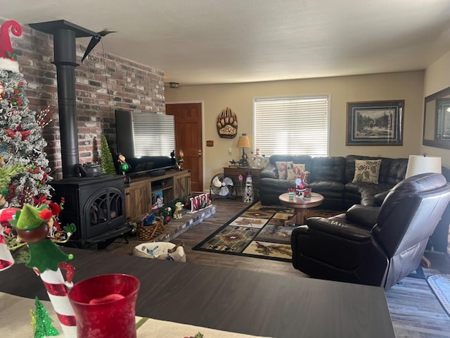 living area featuring a wood stove and wood finished floors