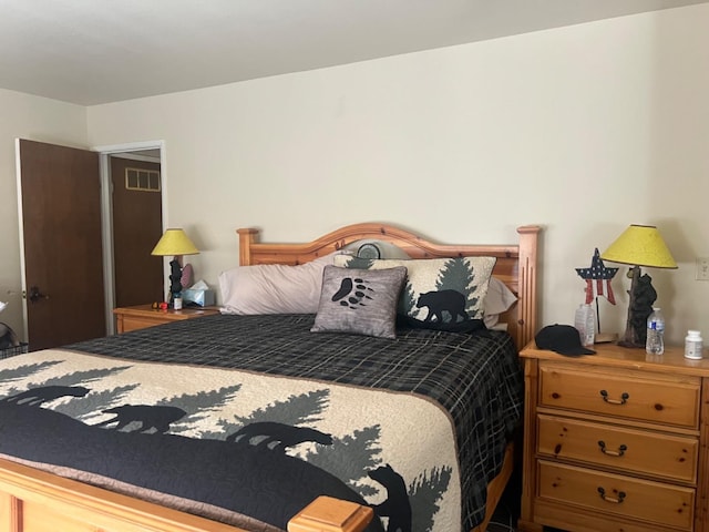 bedroom featuring visible vents