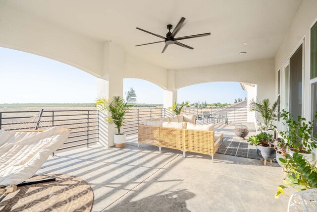 view of patio with ceiling fan and outdoor lounge area