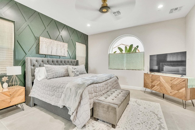 tiled bedroom featuring ceiling fan