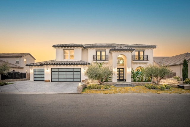 mediterranean / spanish house with a garage