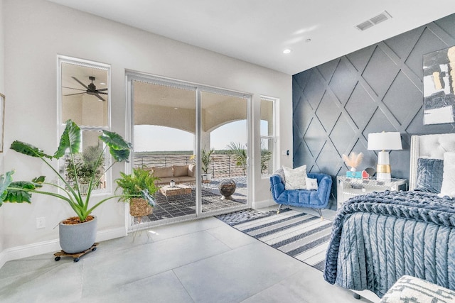 bedroom with access to exterior and tile patterned floors