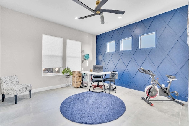 interior space with ceiling fan and tile patterned floors