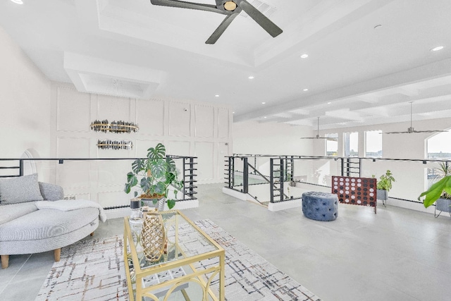 living room featuring ceiling fan and beamed ceiling