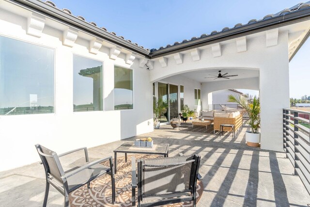 view of patio featuring an outdoor living space and ceiling fan