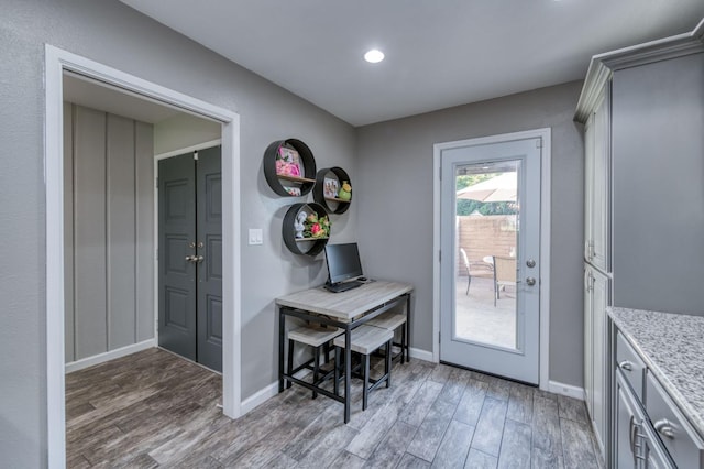 doorway with wood-type flooring