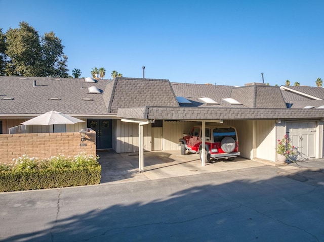 single story home featuring a carport