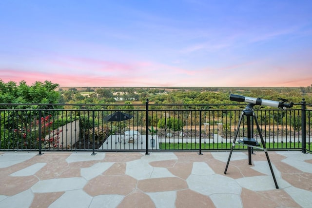 view of patio terrace at dusk