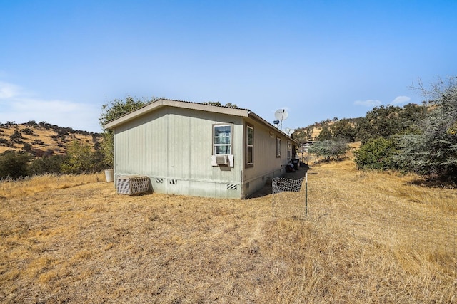 view of property exterior with cooling unit