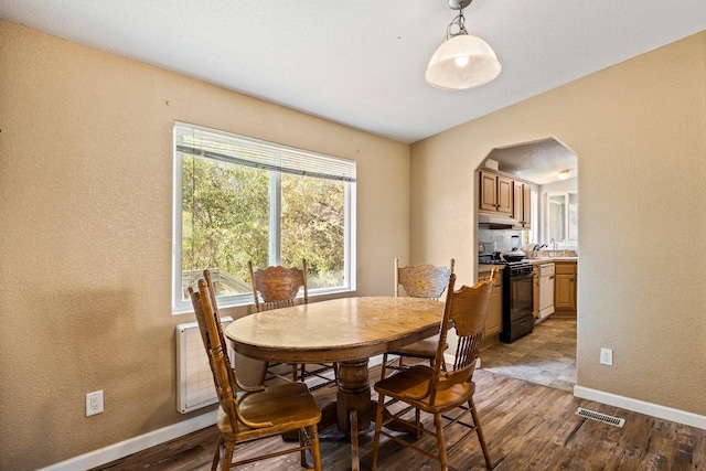 dining area featuring hardwood / wood-style floors