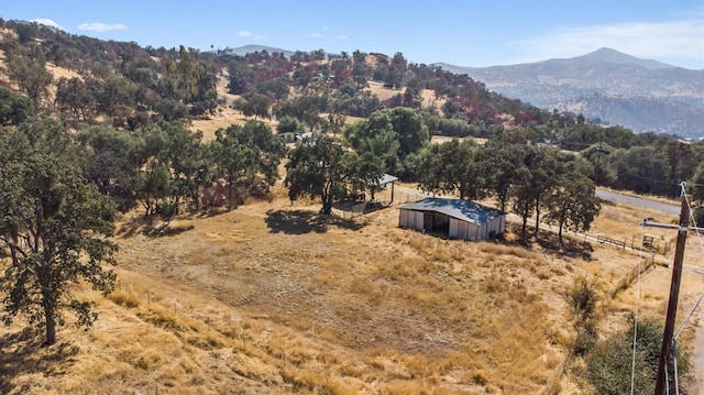 drone / aerial view with a mountain view and a rural view