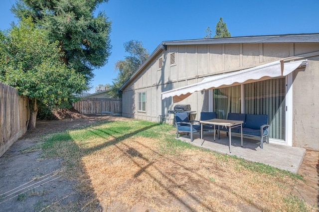 view of yard featuring a patio area and a fenced backyard