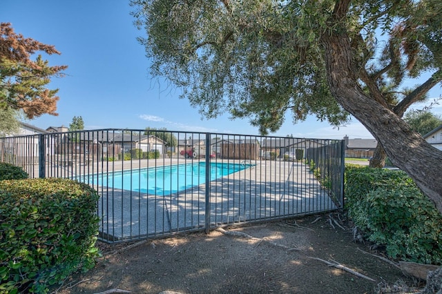 pool featuring a patio area and fence