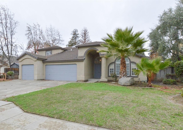 view of front of house with a front yard and a garage