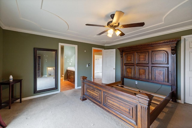 carpeted bedroom with ornamental molding, ceiling fan, and ensuite bathroom