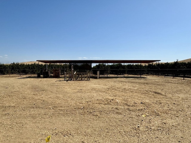 view of yard with a rural view