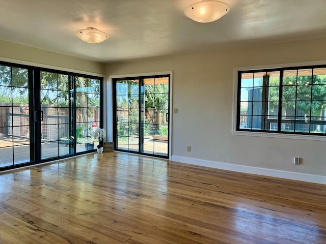 unfurnished room featuring hardwood / wood-style flooring