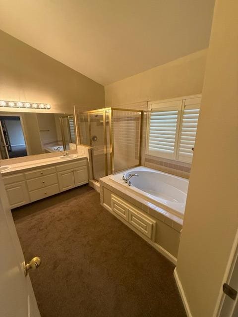 bathroom with vanity, plus walk in shower, and vaulted ceiling