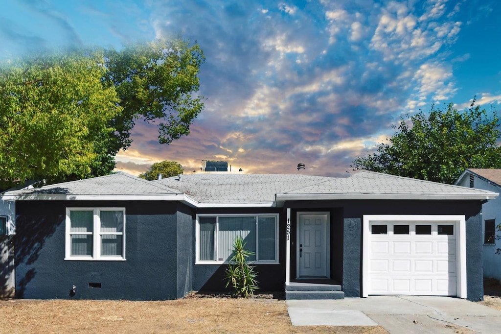 ranch-style house featuring a garage