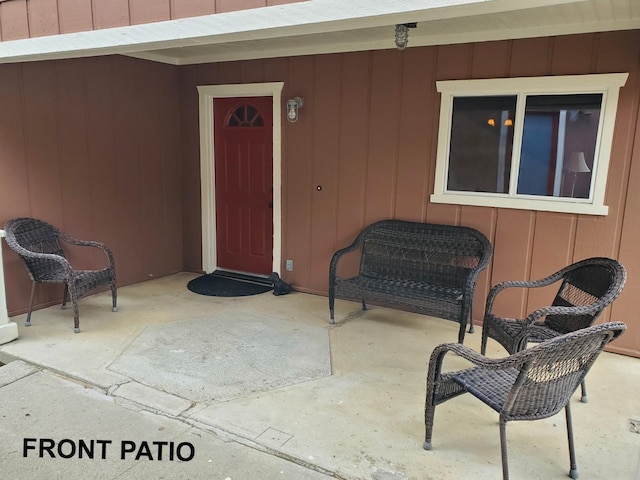 property entrance featuring a patio area