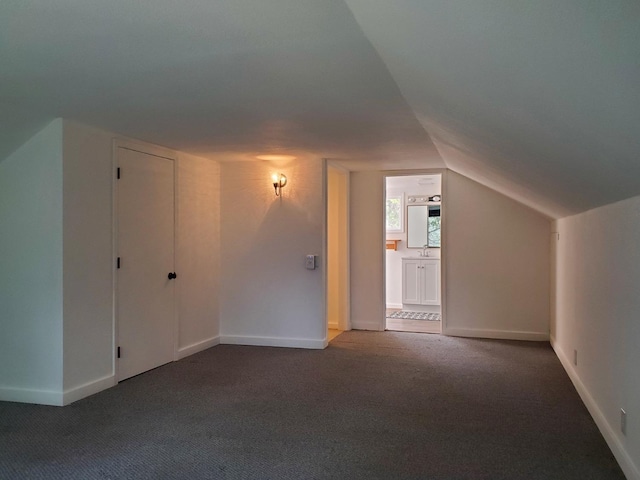 bonus room featuring carpet and lofted ceiling