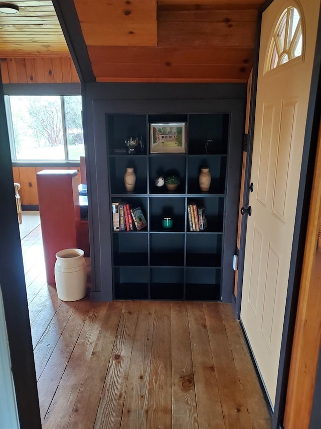 interior space with wood ceiling and hardwood / wood-style floors