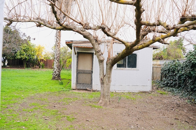 view of side of property featuring a yard