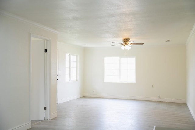 unfurnished room with ceiling fan, crown molding, light hardwood / wood-style floors, and a textured ceiling