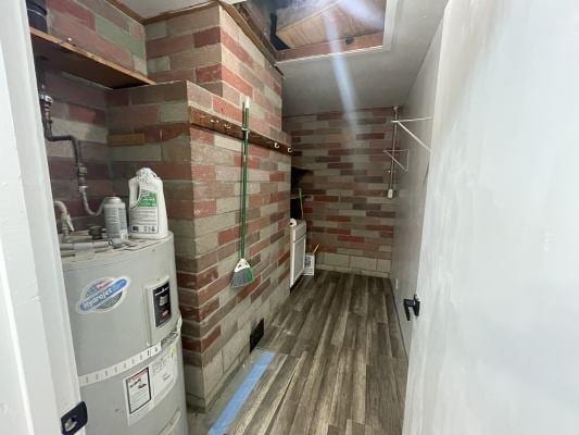 utility room with water heater