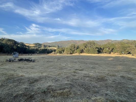 view of mountain feature with a rural view